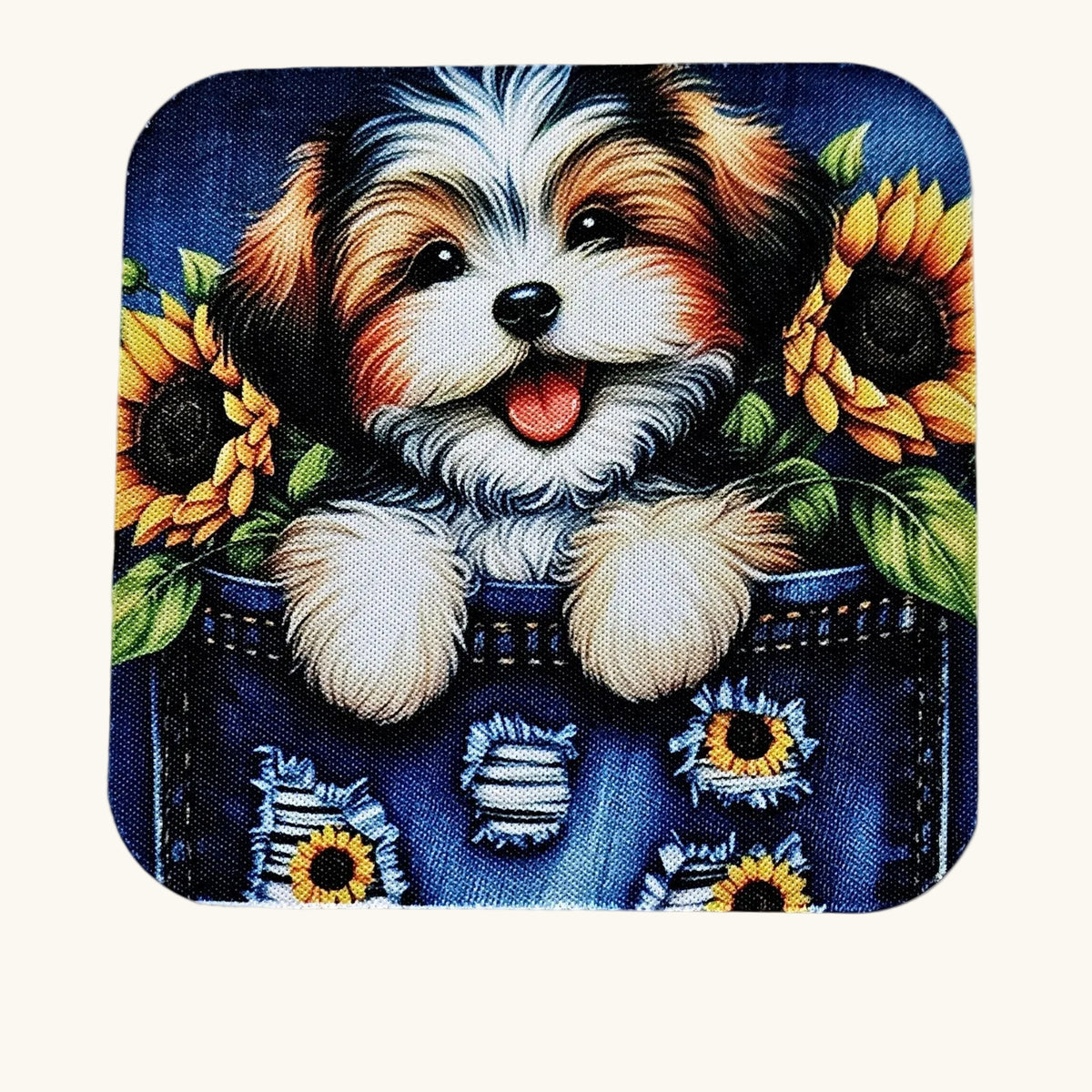 A square coaster with rounded corners featuring a colorful illustration of a fluffy dog peeking out of a denim pocket with sunflowers.